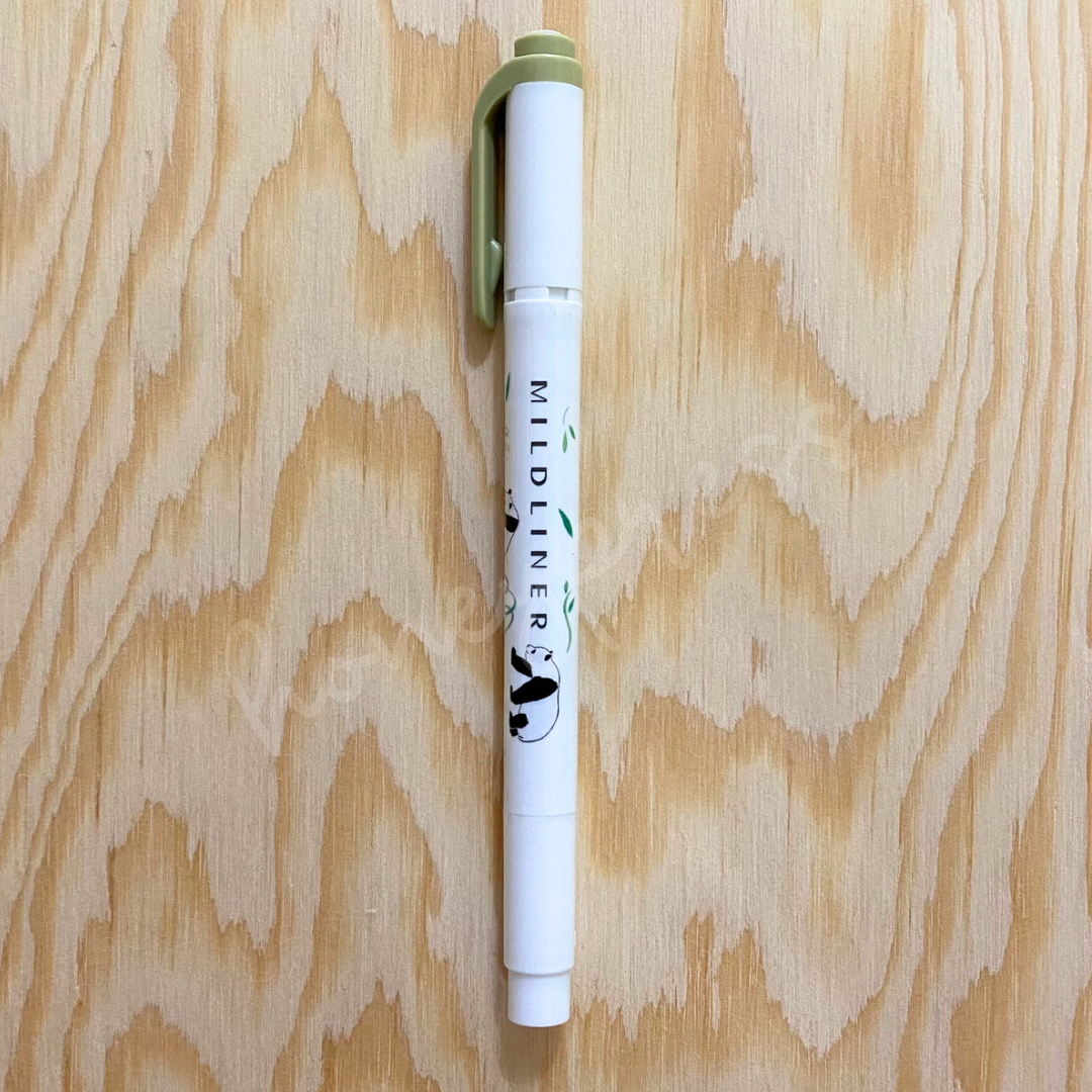 An upright highlighter with an olive green colored cap, white body, and a panda image.