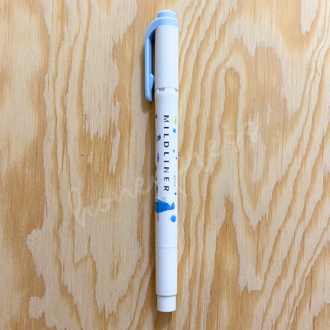 An upright highlighter with a blue colored cap, white body, and a blue penguin image.