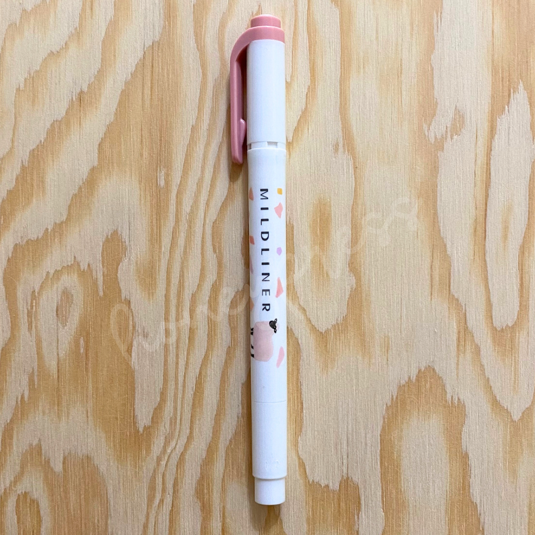 An upright highlighter with a pink colored cap, white body, and a pink sheep image.