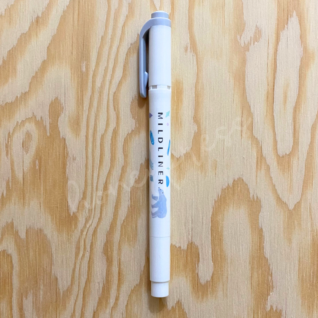 An upright highlighter with a gray colored cap, white body, and a polar bear image.